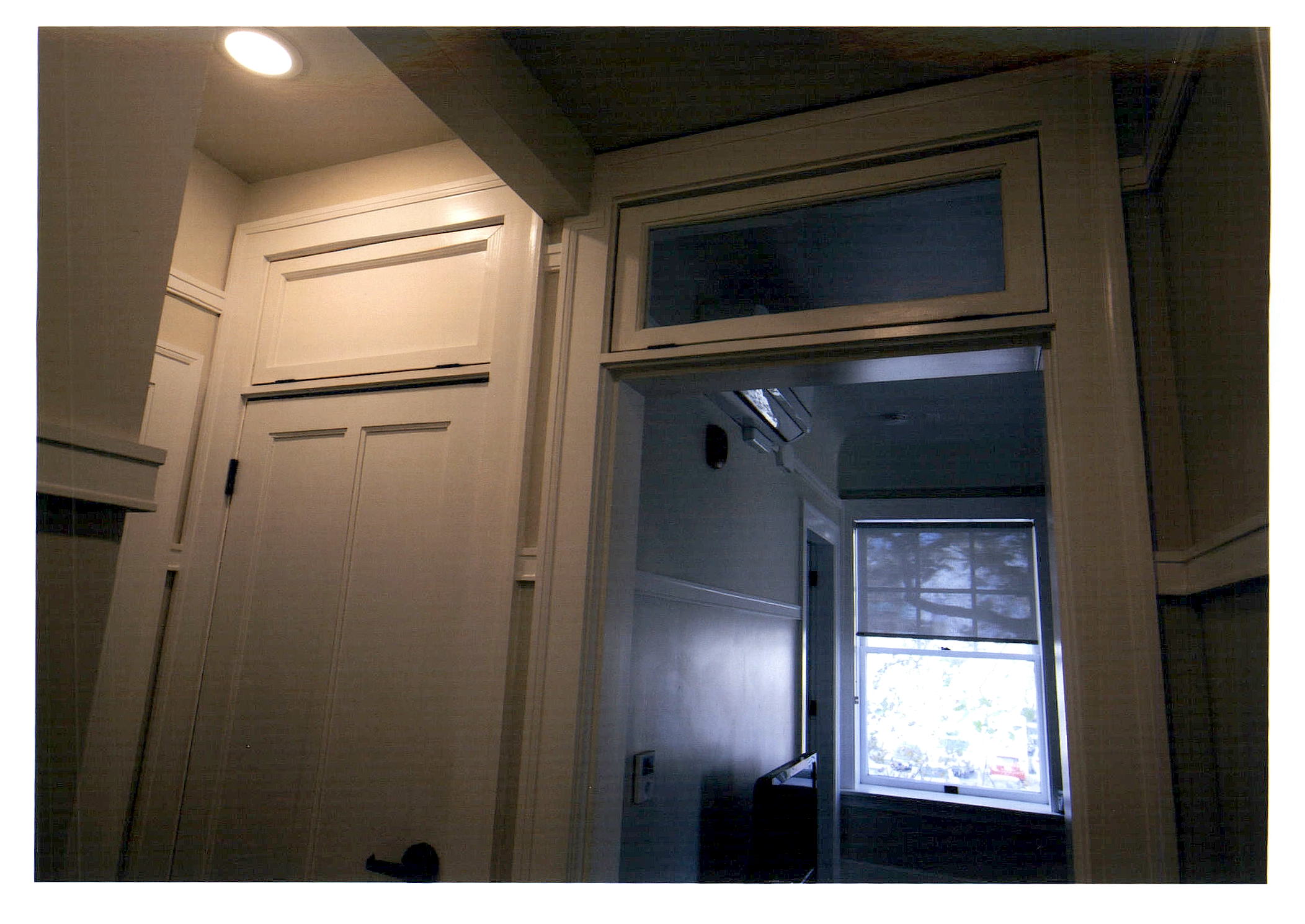 After: close-up of hallway showing apartment entrances.